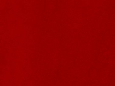 Arka plan olarak kırmızı kadife kumaş dokusu kullanılıyor. Yumuşak ve pürüzsüz tekstil malzemelerinden oluşan boş kırmızı kumaş arka plan. Metin için boşluk var.