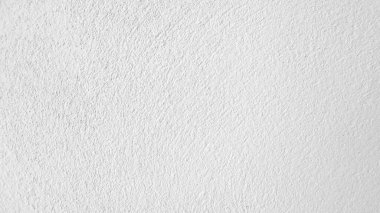 Seamless texture of white cement wall a rough surface, with space for text, for a background..	