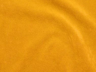 Yellow velvet fabric texture used as background. Empty yellow fabric background of soft and smooth textile material. There is space for text..	