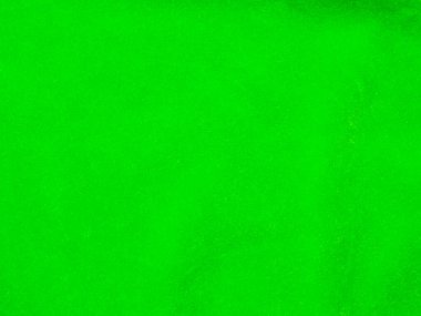 Açık yeşil kadife kumaş dokusu arka plan olarak kullanılır. Yumuşak ve pürüzsüz tekstil malzemelerinden oluşan boş yeşil kumaş arka planı. Metin için boşluk var..