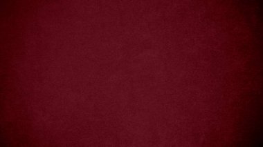 Arka plan olarak kullanılan koyu kırmızı kadife kumaş dokusu. Yumuşak ve pürüzsüz tekstil malzemesinin ton rengi kırmızı kumaş arka planı. Metin ve tüm tasarım işleri için yer var