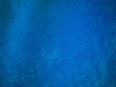 Arka plan olarak kullanılan açık mavi kadife kumaş dokusu. Yumuşak ve pürüzsüz tekstil malzemesinin ton rengi mavi kumaş arka planı. Metin ve tüm tasarım işleri için yer var