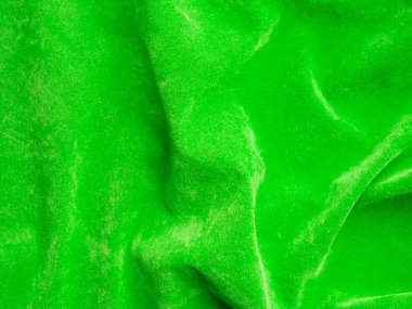 Light green old velvet fabric texture used as background. Empty green fabric background of soft and smooth textile material. There is space for text.	