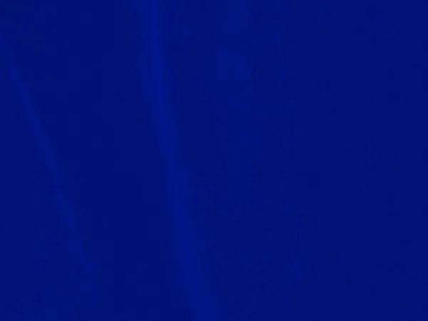 Blue velvet fabric texture used as background. Empty blue fabric background of soft and smooth textile material. There is space for text.
