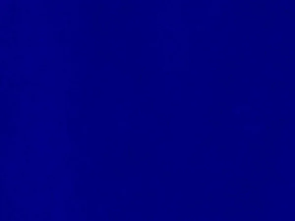 背景にブルーベルベット生地のテクスチャ 柔らかく滑らかな繊維素材の空の青い生地の背景 テキストのスペースがあります — ストック写真