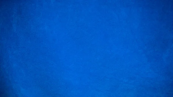 Dark blue velvet fabric texture used as background. Empty dark blue fabric background of soft and smooth textile material. There is space for text.