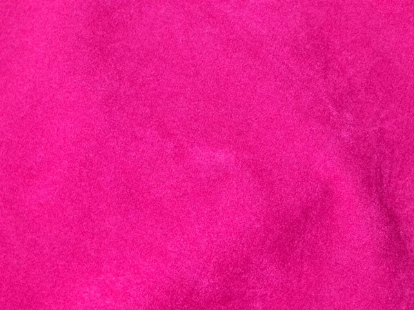 背景として使われるピンクベルベット生地の質感 柔らかく滑らかな繊維素材の空のピンクの生地の背景 テキストのスペースがあります — ストック写真