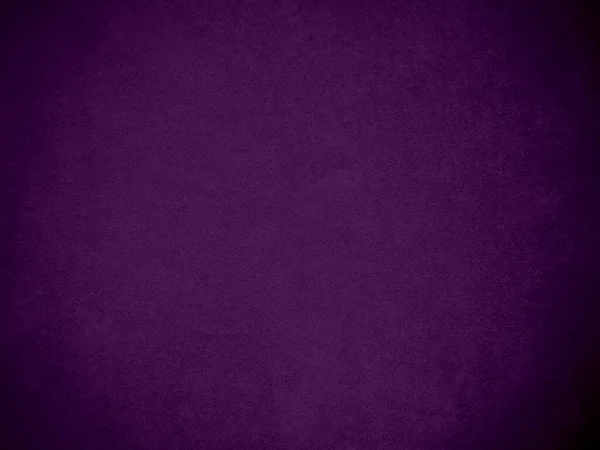 Dark purple velvet fabric texture used as background. Tone color purple cloth  background of soft and smooth textile material. There is space for text and for all types of design work