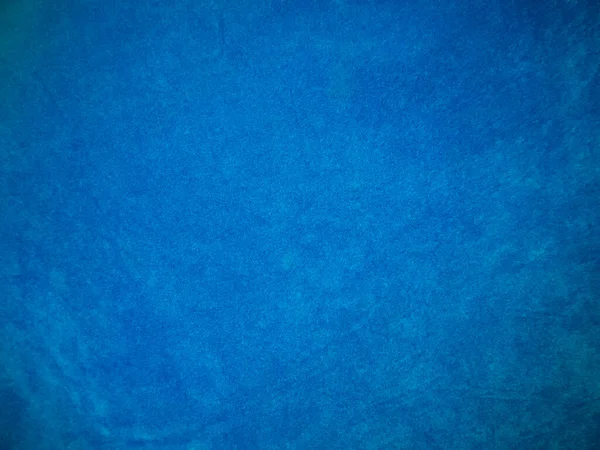 Light blue velvet fabric texture used as background. Tone color blue cloth  background of soft and smooth textile material. There is space for text and for all types of design work