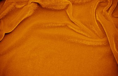 Orange velvet fabric texture used as background. Empty Orange fabric background of soft and smooth textile material. There is space for text..	