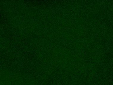 Dark green old velvet fabric texture used as background. Empty green fabric background of soft and smooth textile material. There is space for text..	