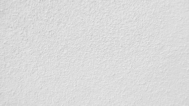 Seamless texture of white cement wall a rough surface, with space for text, for a background.	