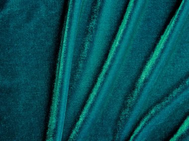 Dark green old velvet fabric texture used as background. Empty green fabric background of soft and smooth textile material. There is space for text..	