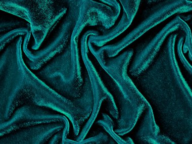 Dark green old velvet fabric texture used as background. Empty green fabric background of soft and smooth textile material. There is space for text..	