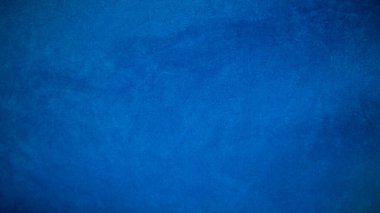 Arka plan olarak mavi kadife kumaş dokusu kullanılıyor. Yumuşak ve pürüzsüz tekstil malzemelerinin boş mavi kumaş arka planı. Metin için boşluk var.