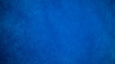 Arka plan olarak mavi kadife kumaş dokusu kullanılıyor. Yumuşak ve pürüzsüz tekstil malzemelerinin boş mavi kumaş arka planı. Metin için boşluk var.