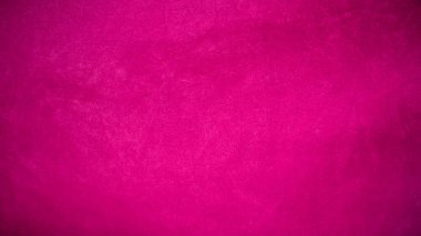 Arka plan olarak kullanılan pembe kadife kumaş dokusu. Yumuşak ve pürüzsüz tekstil malzemelerinin boş pembe kumaş arka planı. Metin için boşluk var.