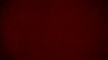 Arka plan olarak kırmızı kadife kumaş dokusu kullanılıyor. Yumuşak ve pürüzsüz tekstil malzemelerinden oluşan boş kırmızı kumaş arka plan. Metin için boşluk var.