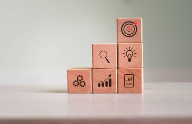 Dart board, conceptualization to lead to the right goal. cube block to contain the purpose of doing business overcoming challenges Walking towards goals and winning,	