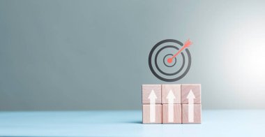 Dart board, conceptualization to lead to the right goal. cube block to contain the purpose of doing business overcoming challenges Walking towards goals and winning,	