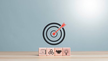 Dart board, conceptualization to lead to the right goal. cube block to contain the purpose of doing business overcoming challenges Walking towards goals and winning,	