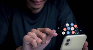 Concept with notification icons of like being happy.and social media interactions on mobile phone,message, email, comment ,businessman hands holding device,smartphone, internet digital marketing.	
