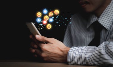 Concept with notification icons of like being happy.and social media interactions on mobile phone,message, email, comment ,businessman hands holding device,smartphone, internet digital marketing.	
