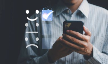 Businessman are touching the virtual screen on the happy Smiley face icon to give satisfaction in service. rating very impressed.digital marketing,Customer service and satisfaction concept.	