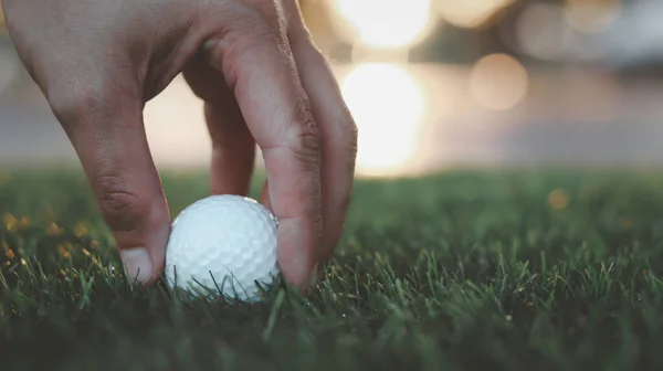 Golfer Hand Holds Golf Ball Close Tee Grass Blurred Beautiful — Stock Fotó