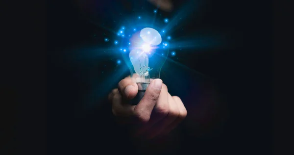 Businessman holding a light bulb, Creative new idea. Innovation, brainstorming, solution and inspiration concepts. imagination, creative thinking problem solving..