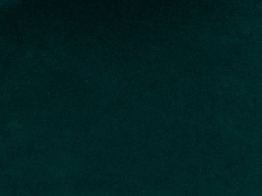 Arka plan olarak kullanılan koyu yeşil kadife kumaş dokusu. Yumuşak ve pürüzsüz tekstil malzemelerinden oluşan boş yeşil kumaş arka planı. Metin için boşluk var.