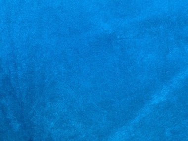 Arka plan olarak kullanılan açık mavi kadife kumaş dokusu. Yumuşak ve pürüzsüz tekstil malzemelerinin açık mavi kumaş arka planı. Metin için boşluk var.