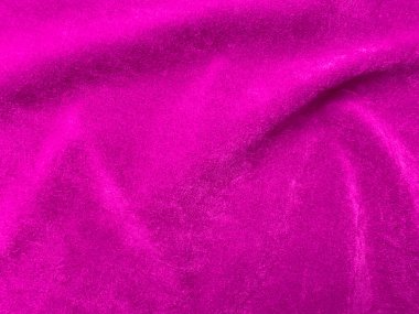 Pink velvet fabric texture used as background. Empty pink fabric background of soft and smooth textile material. There is space for text..	
