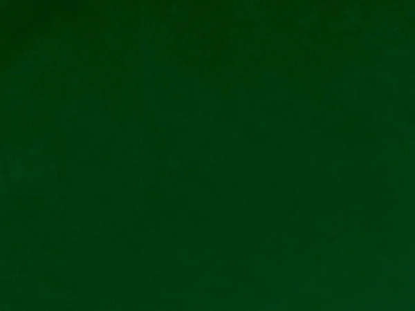 背景にはダークグリーンの古いベルベット生地のテクスチャ 柔らかく滑らかな繊維素材の空の緑の生地の背景 テキストのスペースがあります — ストック写真
