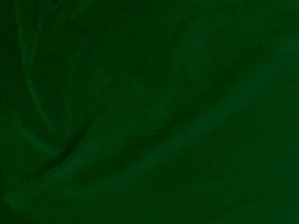 背景にはダークグリーンの古いベルベット生地のテクスチャ 柔らかく滑らかな繊維素材の空の緑の生地の背景 テキストのスペースがあります — ストック写真