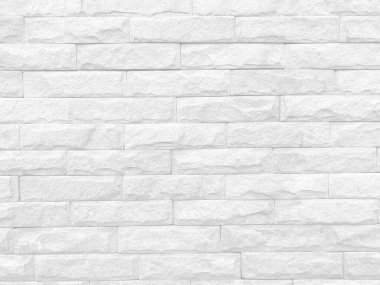 Seamless texture of white stone wall a rough surface, with space for text, for a background.	
