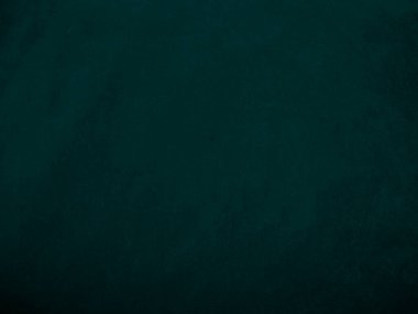 Dark green old velvet fabric texture used as background. Empty green fabric background of soft and smooth textile material. There is space for text..	