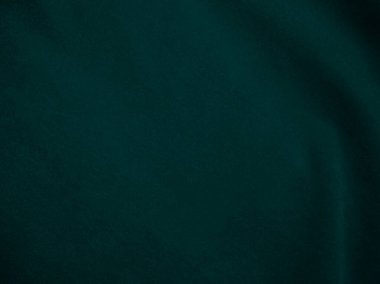 Dark green old velvet fabric texture used as background. Empty green fabric background of soft and smooth textile material. There is space for text..	