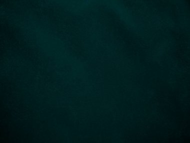 Dark green old velvet fabric texture used as background. Empty green fabric background of soft and smooth textile material. There is space for text..	