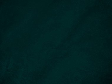 Dark green old velvet fabric texture used as background. Empty green fabric background of soft and smooth textile material. There is space for text..	