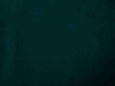 Dark green old velvet fabric texture used as background. Empty green fabric background of soft and smooth textile material. There is space for text..	