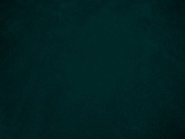 Dark green old velvet fabric texture used as background. Empty green fabric background of soft and smooth textile material. There is space for text..	