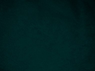 Dark green old velvet fabric texture used as background. Empty green fabric background of soft and smooth textile material. There is space for text..	