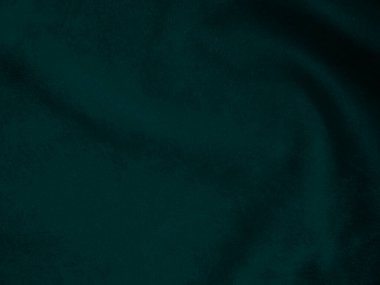 Dark green old velvet fabric texture used as background. Empty green fabric background of soft and smooth textile material. There is space for text..	