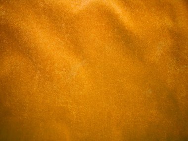 Yellow velvet fabric texture used as background. Empty yellow fabric background of soft and smooth textile material. There is space for text.	