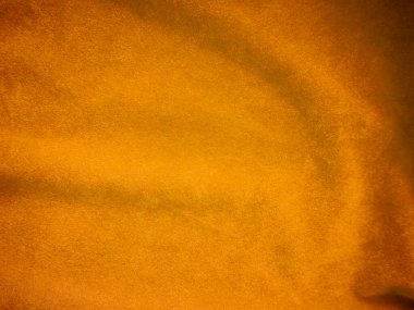 Yellow velvet fabric texture used as background. Empty yellow fabric background of soft and smooth textile material. There is space for text.	