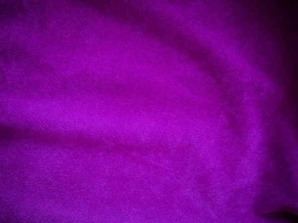 Purple velvet fabric texture used as background. Luxury violet fabric background of soft and smooth textile material. There is space for text.