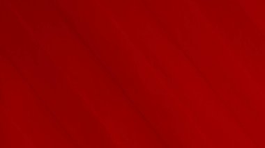 Arka plan olarak kırmızı kadife kumaş dokusu kullanılıyor. Yumuşak ve pürüzsüz tekstil malzemelerinden oluşan boş kırmızı kumaş arka plan. Metin için boşluk var.