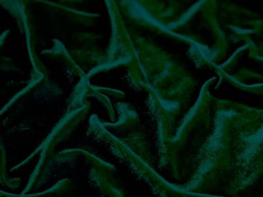 Green velvet fabric texture used as background. Empty green fabric background of soft and smooth textile material. There is space for text.	
