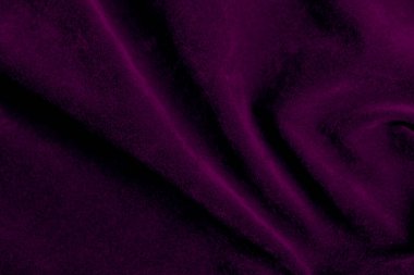 Purple velvet fabric texture used as background. violet fabric background of soft and smooth textile material. There is space for text.	